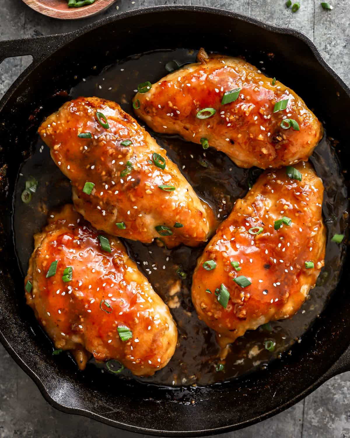 asian chicken breasts in a cast iron skillet.